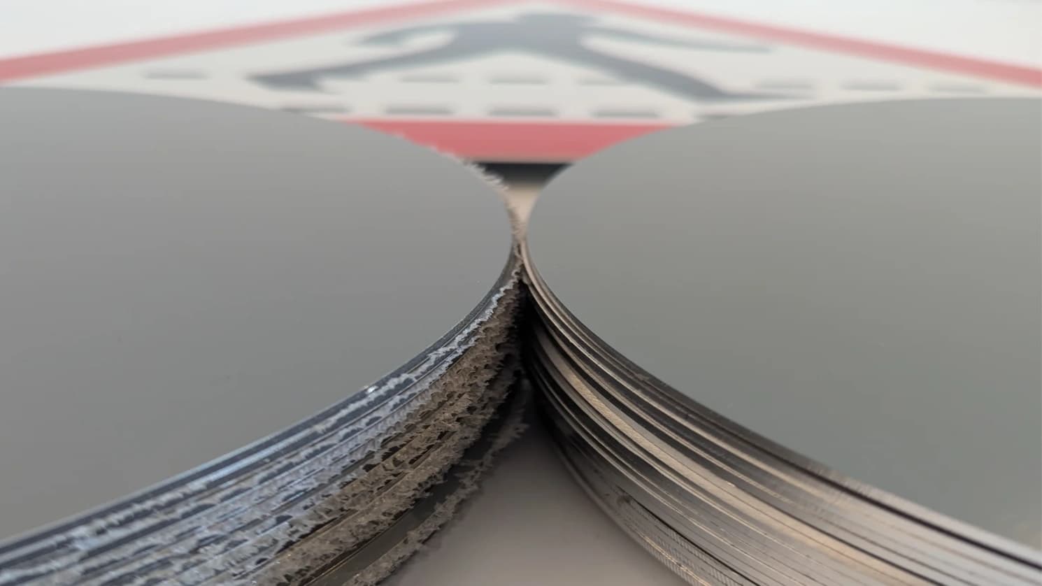 Circle signs made from aluminium and ACM with a pedestrian crossing sign in the background