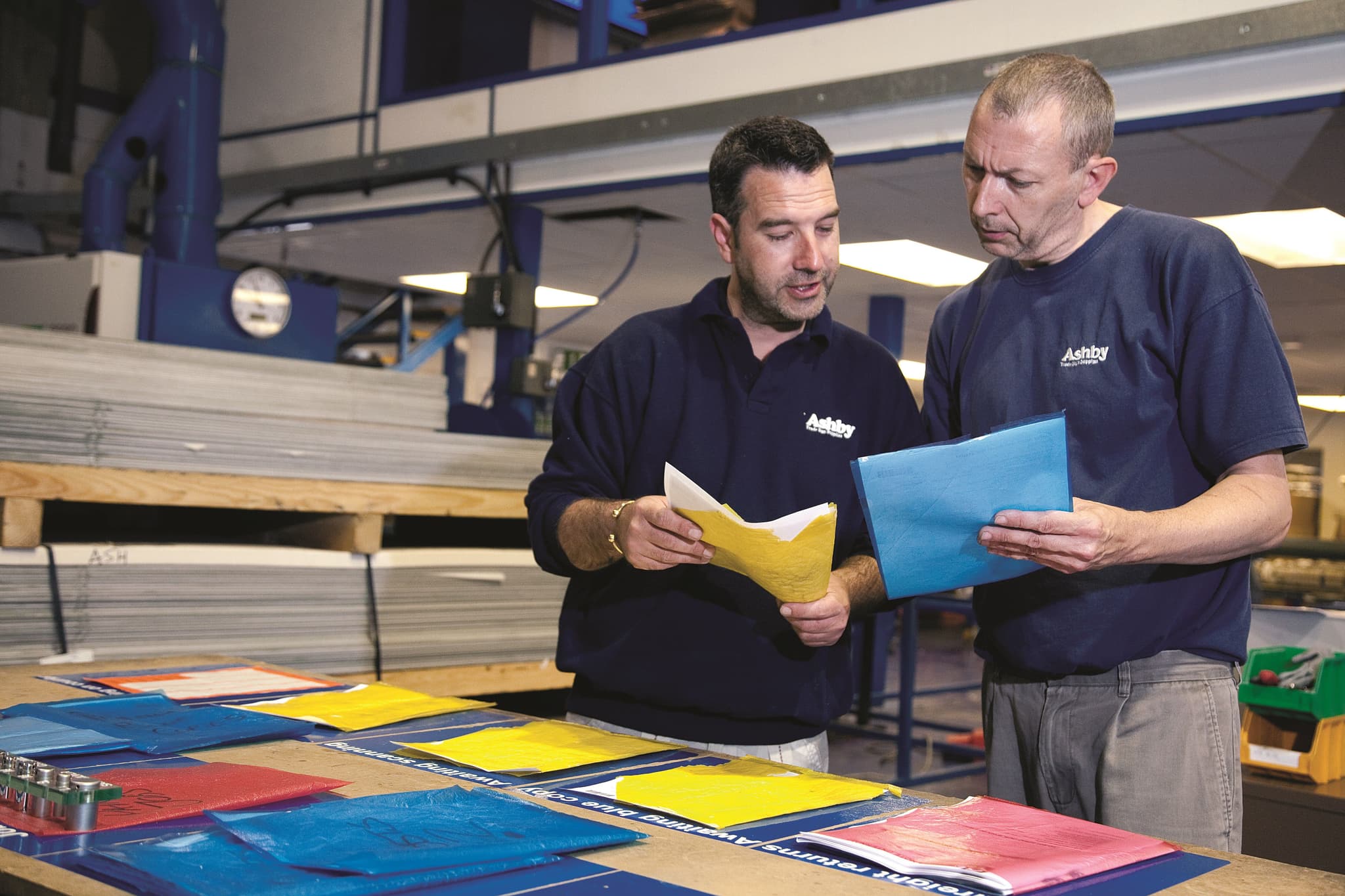 Two sign manufacturers planning their workload.